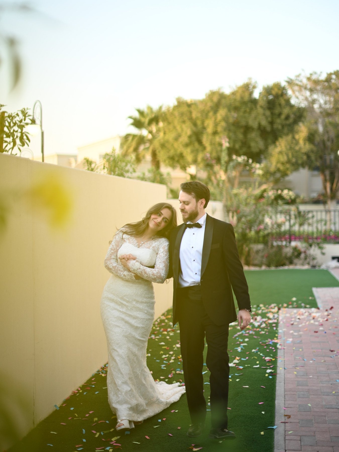 Couple walking under a wooden pergola